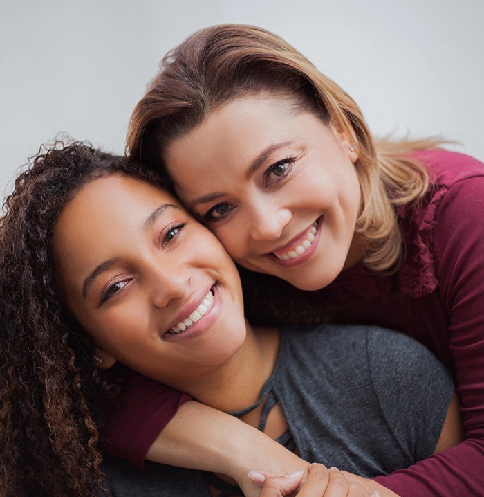 Two women with gorgeous smiles after cosmetic dentistry