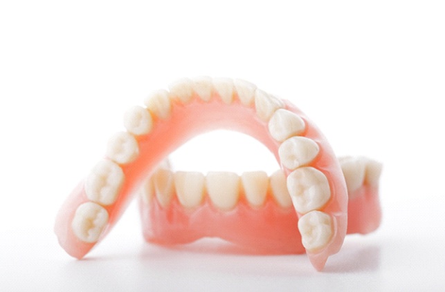 Closeup of dentures in Fitchburg on white background