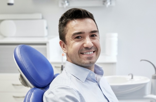 Man in dental chair smiling
