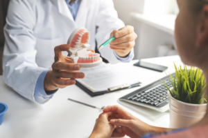 a patient during their dentures consultation